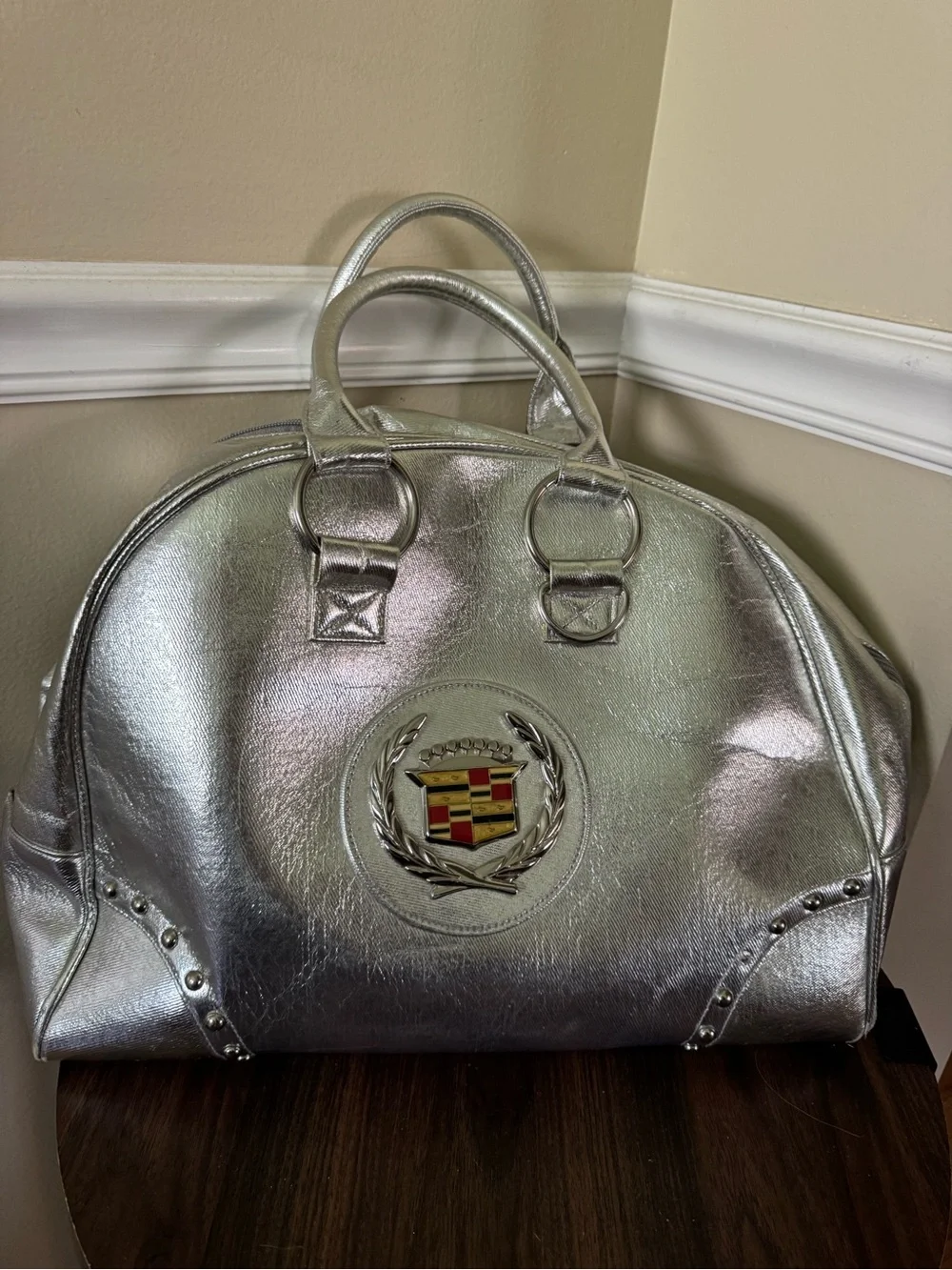 Emblem Metallic Silver Satchel Bag
